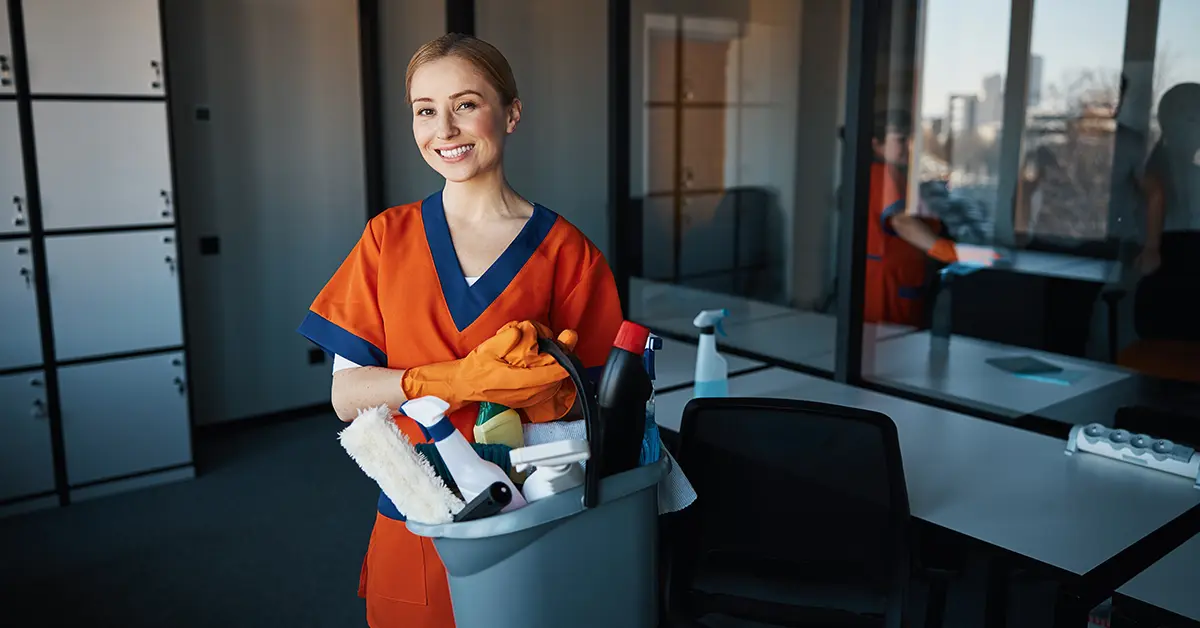 woman smiling with janitorial amenities